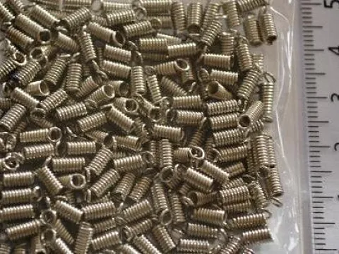 Зажим-кінцевик Пружина