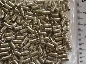 Зажим-кінцевик Пружина