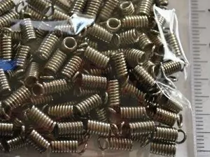 Зажим-кінцевик Пружина