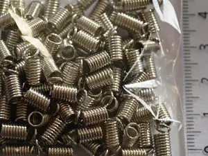 Зажим-кінцевик Пружина