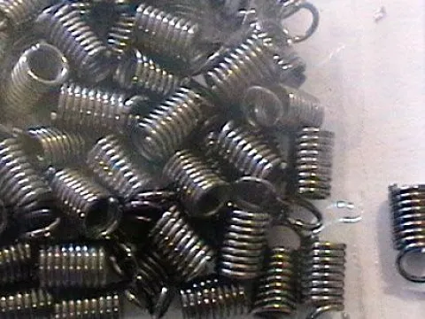 Зажим-кінцевик Пружина