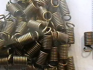 Зажим-кінцевик Пружина