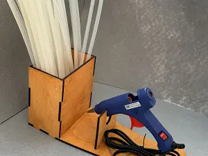 Підставка для клейового пістолета та стержнів.